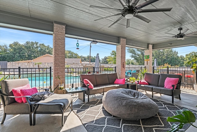 sunroom featuring ceiling fan