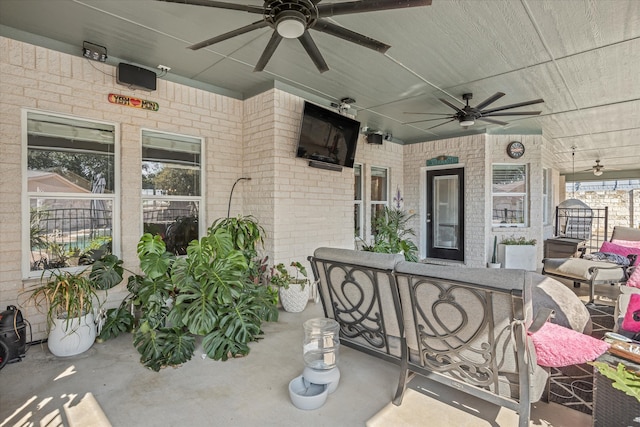 view of patio / terrace featuring ceiling fan