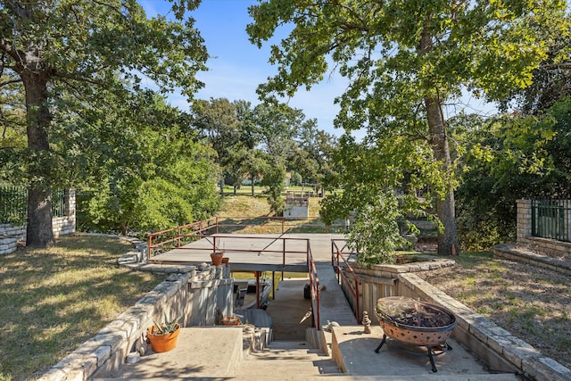 view of patio featuring an outdoor fire pit