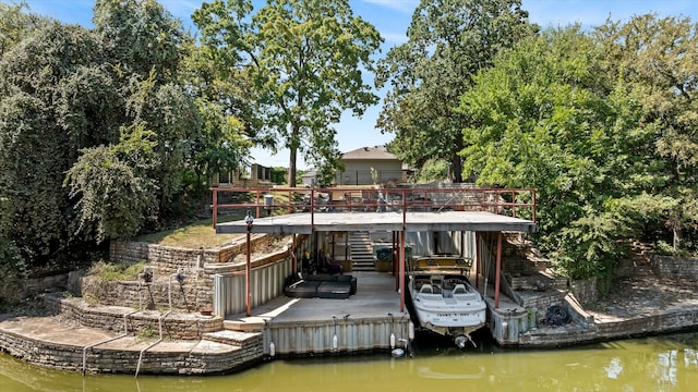 dock area featuring a water view