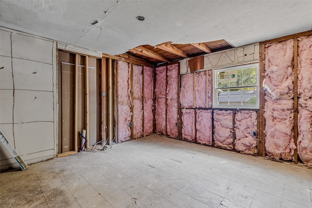 miscellaneous room featuring a textured ceiling