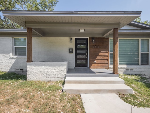 property entrance featuring covered porch