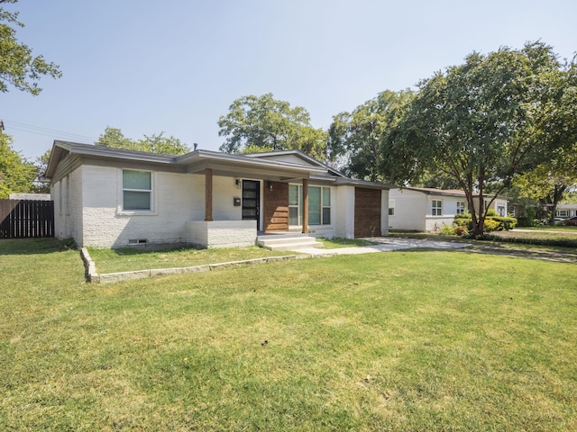 ranch-style home with a front yard