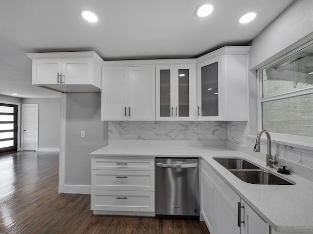 kitchen with white cabinetry, dark wood-type flooring, dishwasher, and sink