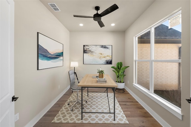 home office featuring hardwood / wood-style floors and ceiling fan