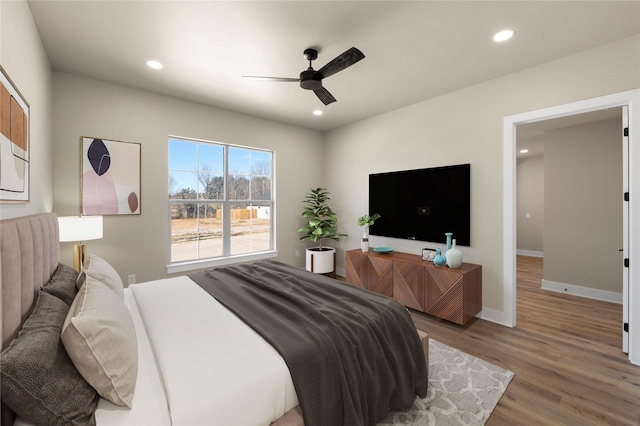 bedroom featuring wood-type flooring and ceiling fan