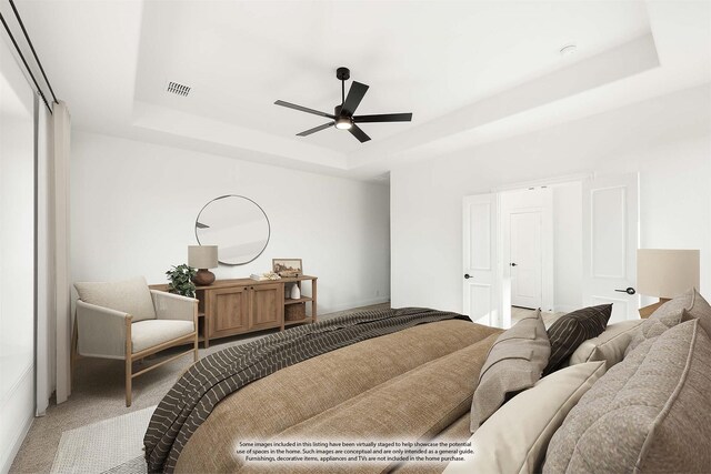 unfurnished bedroom with ceiling fan, a raised ceiling, and light carpet