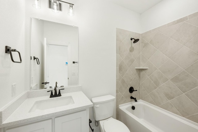 full bathroom featuring tiled shower / bath combo, vanity, and toilet