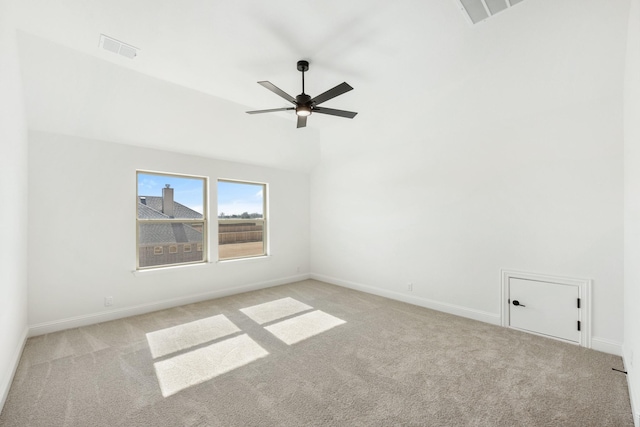 unfurnished room featuring lofted ceiling, light colored carpet, and ceiling fan