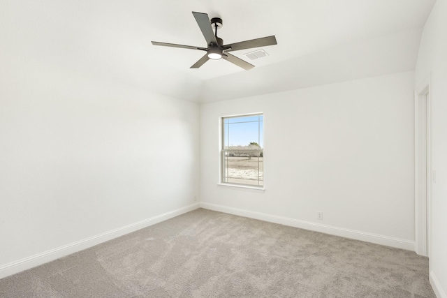 spare room with light carpet and ceiling fan