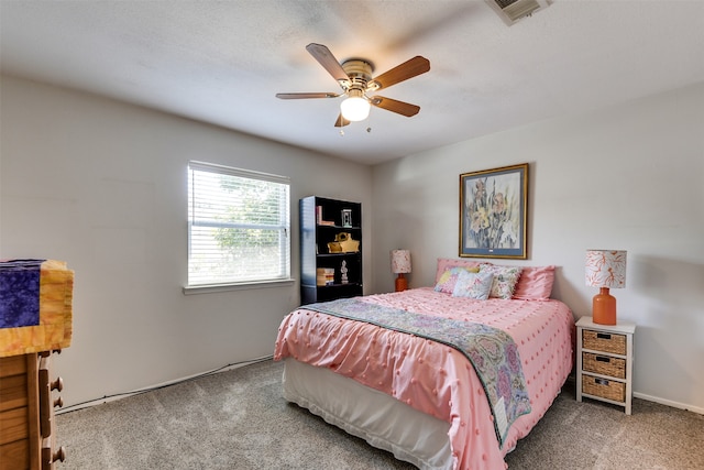 bedroom with a ceiling fan, carpet, and visible vents