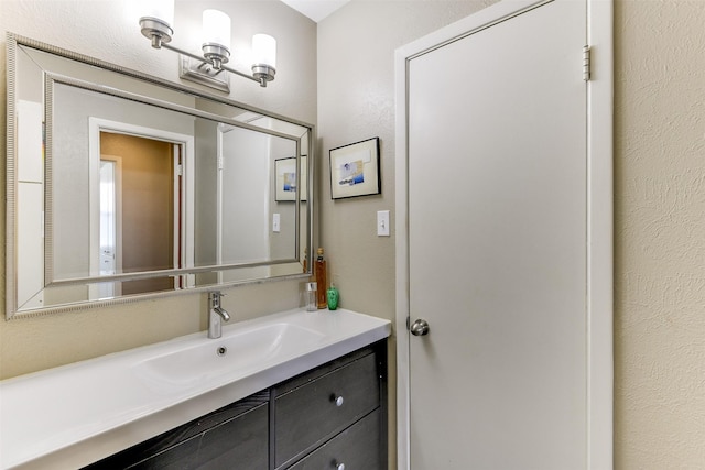 326 E Westview Ter, Arlington, TX 76013 - bathroom featuring vanity and a textured wall