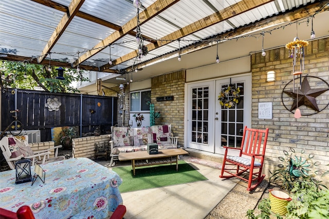 view of patio featuring french doors, fence, and a pergola