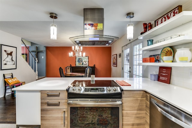 kitchen with decorative light fixtures, a notable chandelier, dark hardwood / wood-style flooring, island exhaust hood, and stainless steel appliances