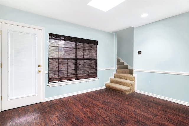 spare room featuring wood-type flooring