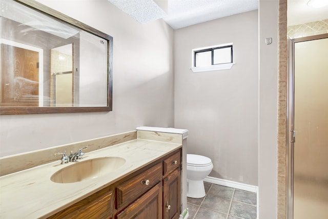 bathroom with vanity, a textured ceiling, tile patterned flooring, toilet, and an enclosed shower