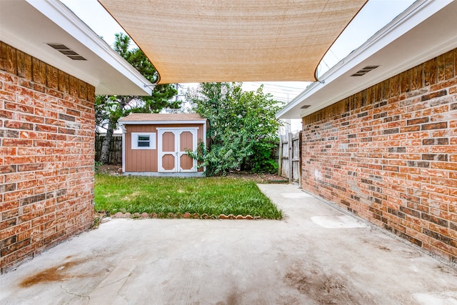 view of patio featuring a shed