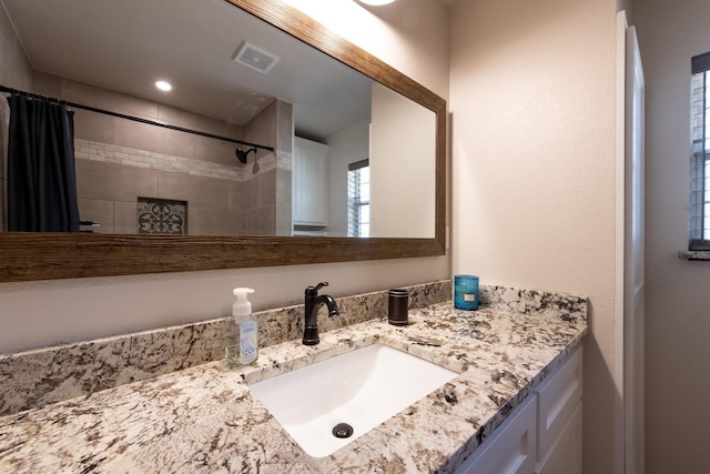 bathroom with vanity and a shower with shower curtain