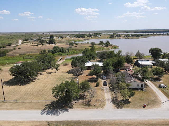 drone / aerial view featuring a rural view and a water view