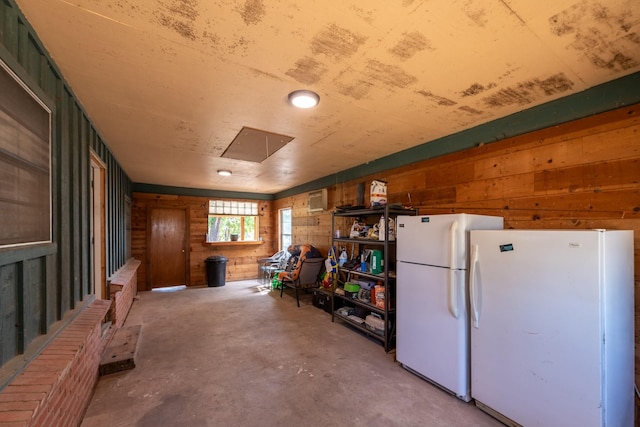 1001 Miller Shores Rd Unit 1, Henrietta, TX 76365 - below grade area featuring freestanding refrigerator and wooden walls