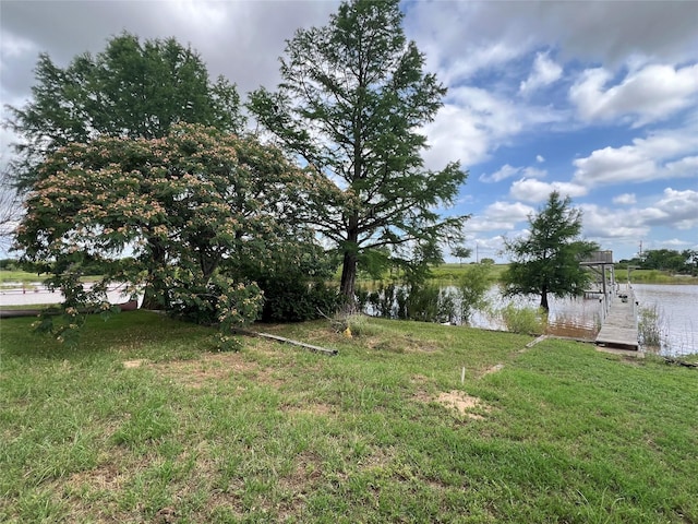 1001 Miller Shores Rd Unit 1, Henrietta, TX 76365 - view of grassy yard with a water view and a boat dock