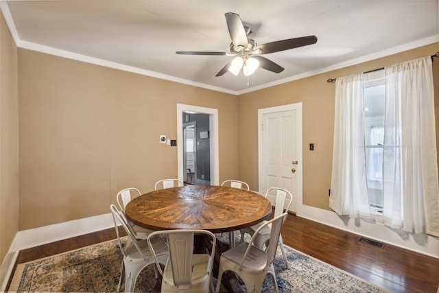 dining room featuring ceiling fan, wood-type flooring, and ornamental molding