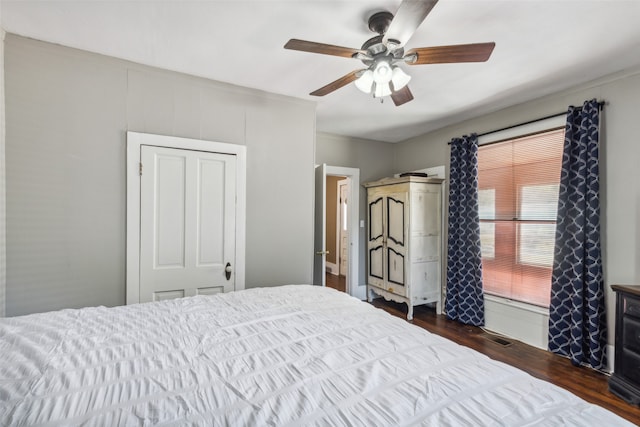 bedroom featuring wood-type flooring and ceiling fan