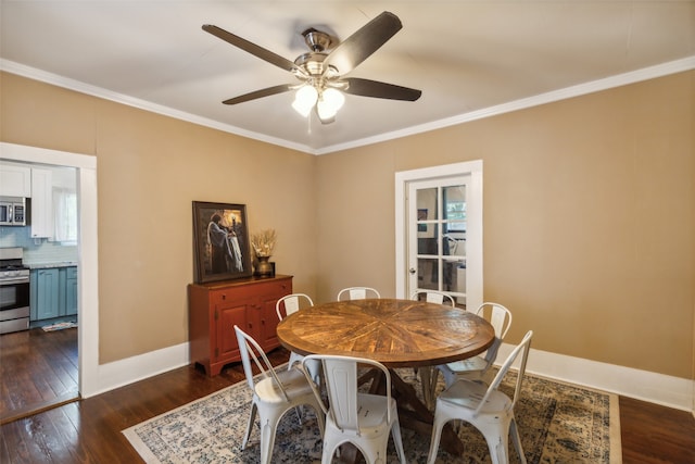 dining room with ceiling fan, crown molding, and dark hardwood / wood-style floors