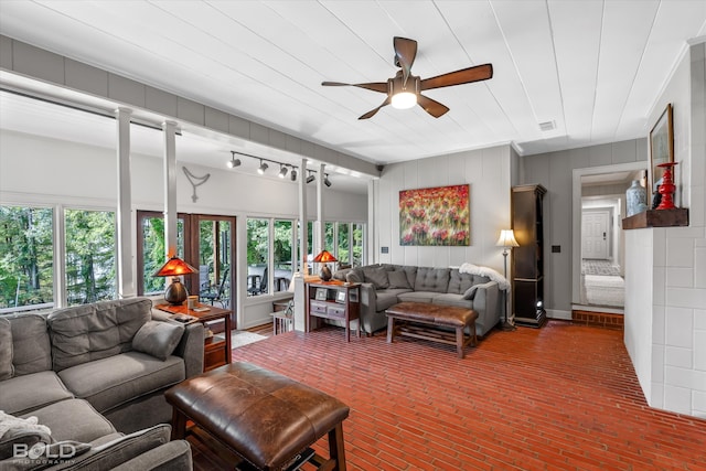 living room featuring ceiling fan and rail lighting