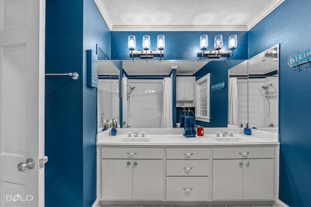 full bathroom with ornamental molding, a sink, and a shower with shower curtain