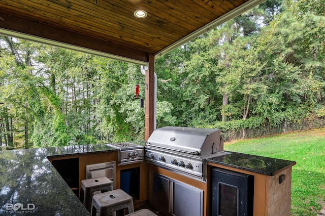 view of patio with exterior kitchen and grilling area