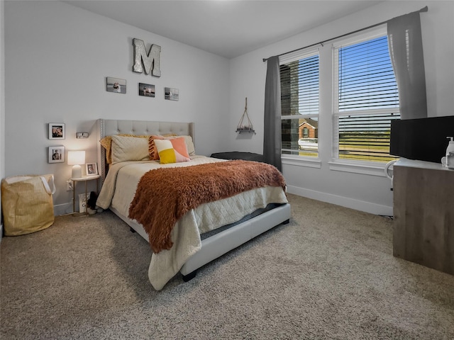 bedroom with carpet flooring and baseboards