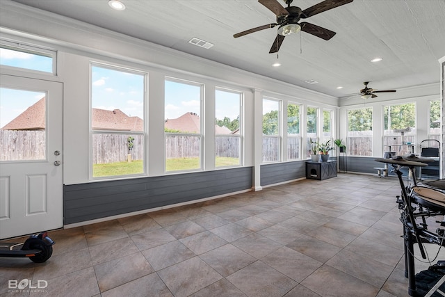 sunroom / solarium with ceiling fan