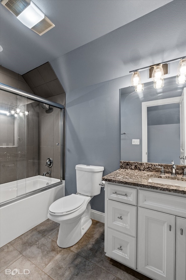 full bathroom featuring shower / bath combination with glass door, vanity, toilet, and tile patterned flooring