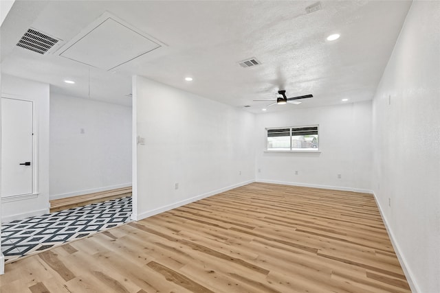 unfurnished room featuring ceiling fan and light hardwood / wood-style floors