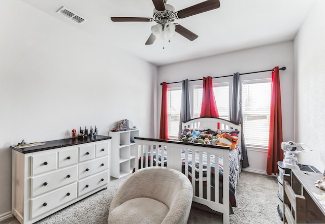 carpeted bedroom with ceiling fan