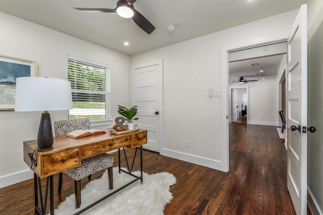 home office featuring dark wood-type flooring and ceiling fan