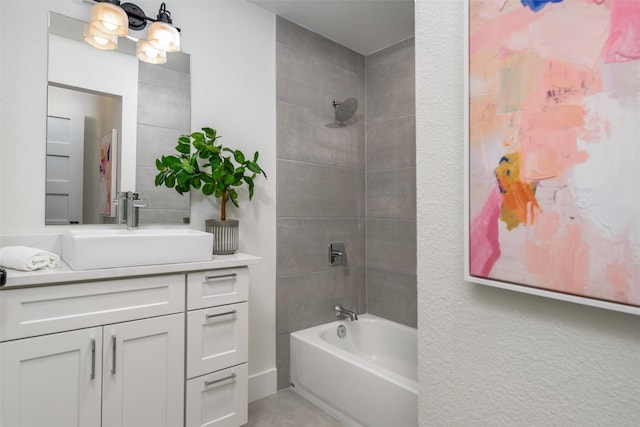 bathroom featuring vanity and tiled shower / bath combo