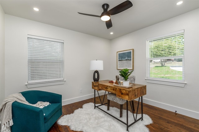 office area featuring dark wood-type flooring and ceiling fan