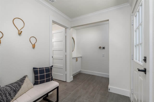 corridor with ornamental molding, plenty of natural light, and hardwood / wood-style floors