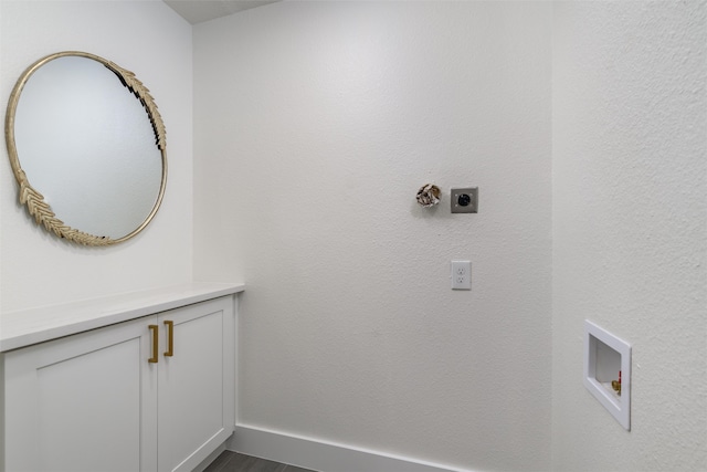 washroom featuring electric dryer hookup, hookup for a washing machine, and dark hardwood / wood-style floors