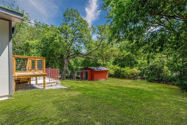 view of yard featuring a shed and a deck