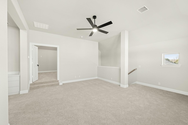 carpeted spare room with ceiling fan