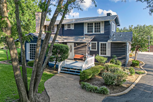 view of front property with a wooden deck