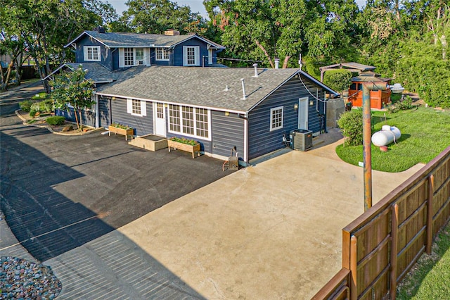 back of house featuring a patio and central air condition unit