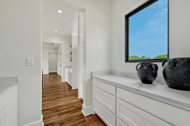 bathroom featuring hardwood / wood-style flooring and vanity