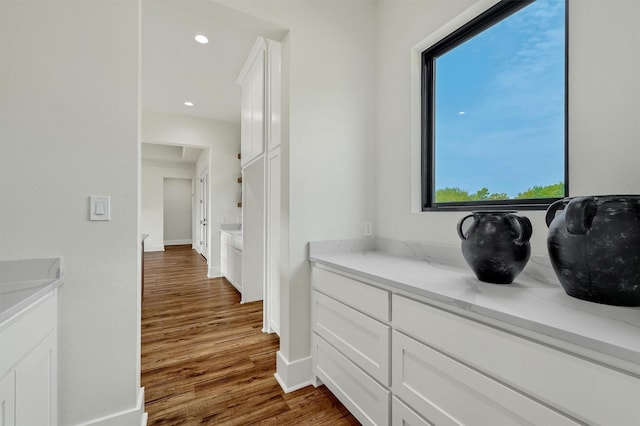 corridor featuring dark hardwood / wood-style flooring