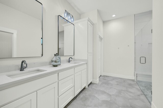 bathroom featuring walk in shower and vanity