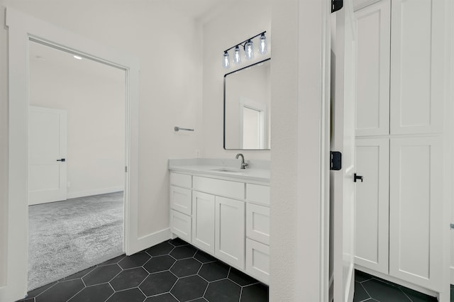 bathroom with tile patterned flooring and vanity