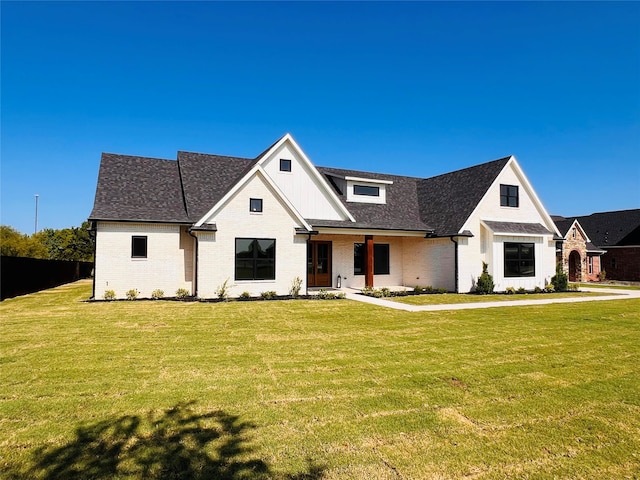 modern inspired farmhouse featuring a front yard